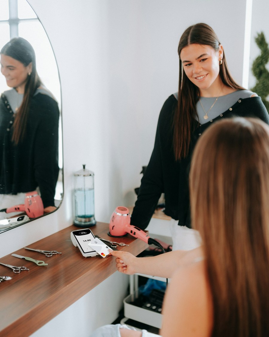 Hair & beauty professional with a customer